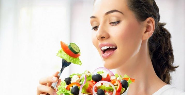 A-Beautiful-Girl-Eating-Healthy-Food-715x403