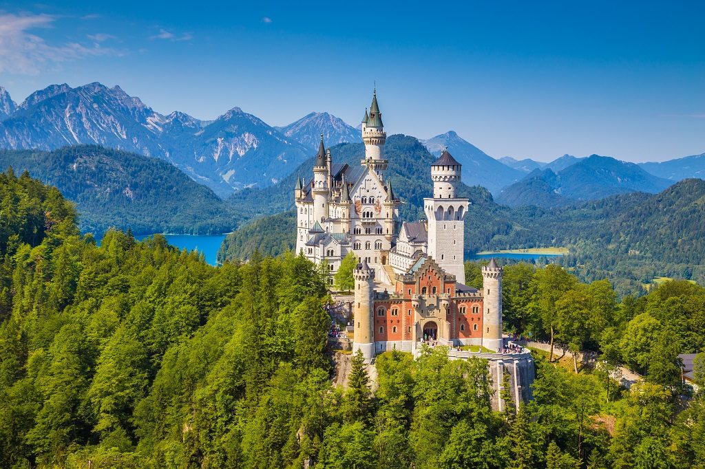 Beautiful view of world-famous Neuschwanstein Castle, the nineteenth-century Romanesque Revival palace built for King Ludwig II on a rugged cliff, with scenic mountain landscape near Füssen, southwest Bavaria, Germany